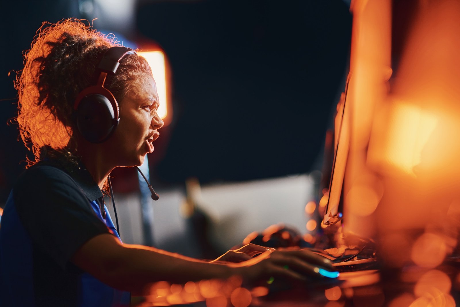 Side view of angry mixed race girl, female cybersport gamer